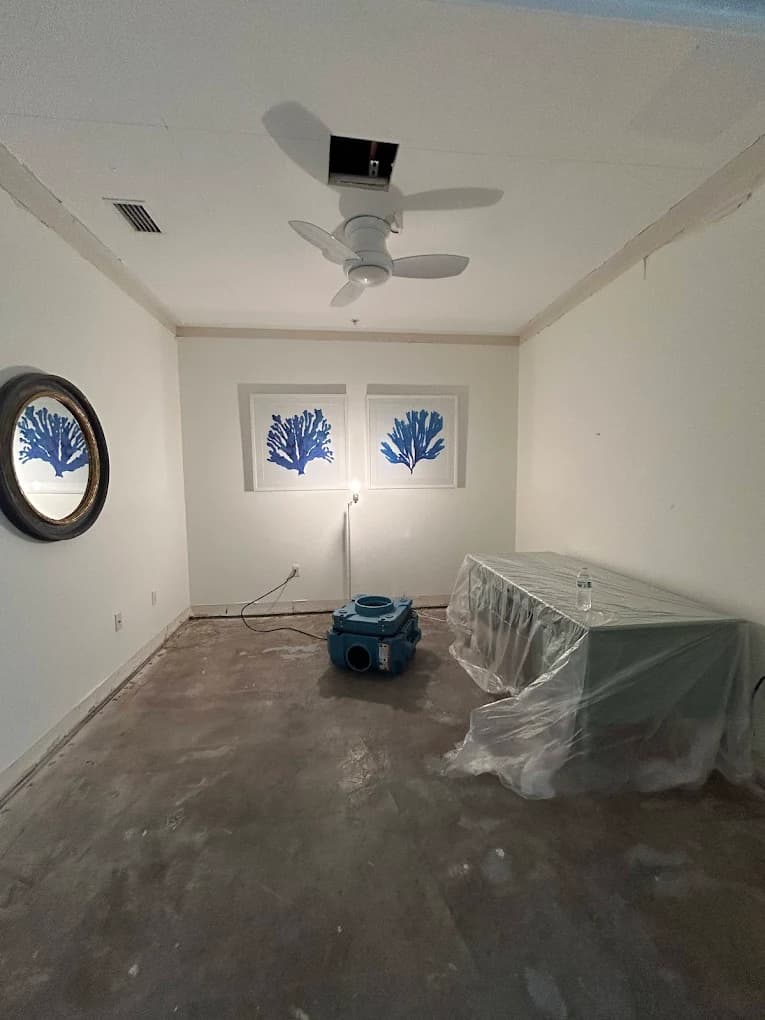 Water damage restoration technician at work in Estero, FL